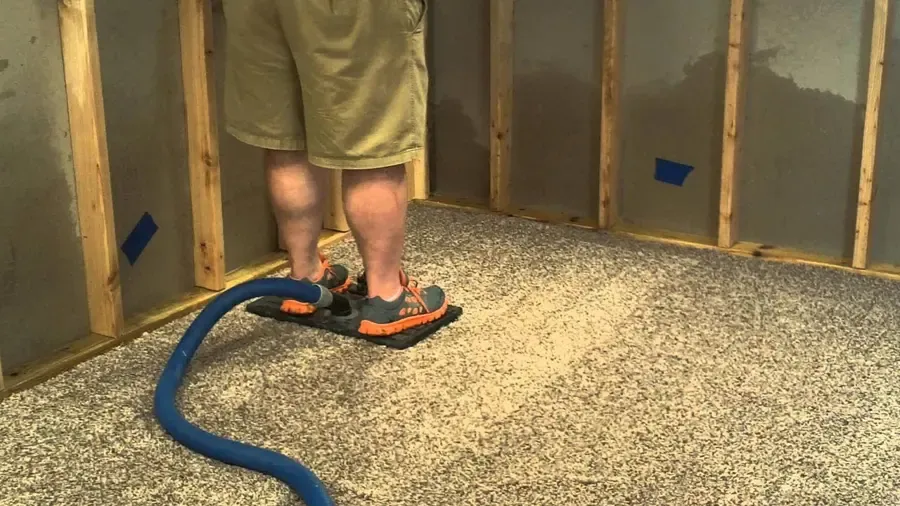 A BustosPro technician working in a water damaged Alpharetta, GA home